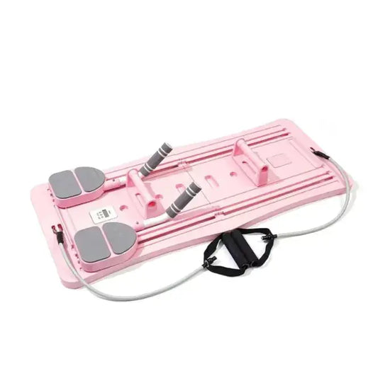 Pink portable Pilates bar reformer board with resistance bands and foot pedals