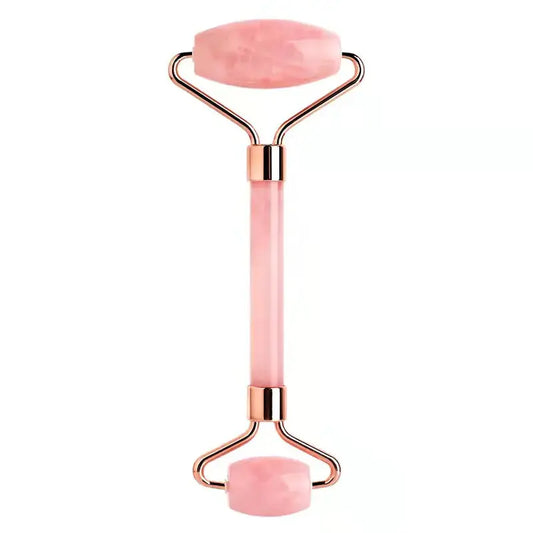 Pink rose quartz facial roller with gold accents for skincare and massage