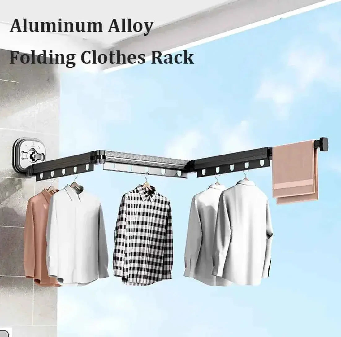 Wall-mounted aluminum alloy folding clothes rack with shirts and towel displayed indoors