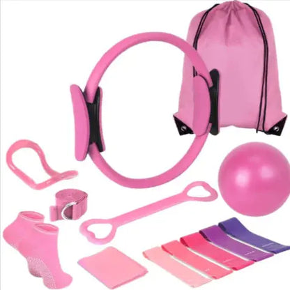 Pink pilates fitness set with ring, ball, resistance bands, socks, and drawstring bag