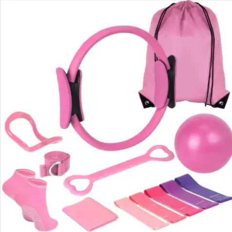 Pink pilates fitness set with ring, ball, resistance bands, socks, and drawstring bag