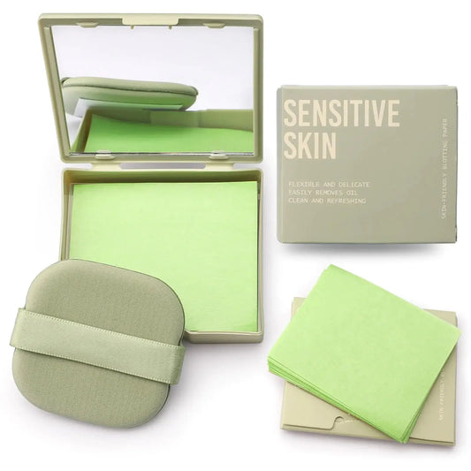 Green oil blotting papers for sensitive skin with mirror compact, applicator, and packaging.