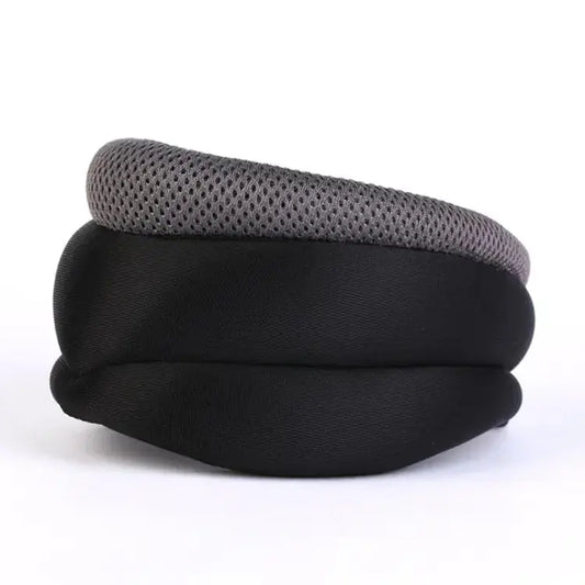 Gray and black padded headphone ear cushion with breathable mesh top on a white background
