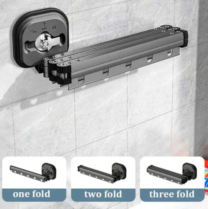 Foldable wall-mounted drying rack with three extension options on tile bathroom wall