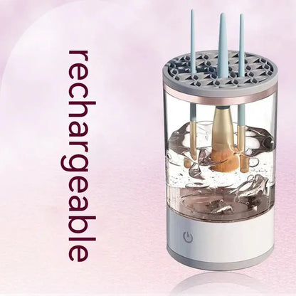 Rechargeable automatic makeup brush cleaner with water tank and power button on pink background